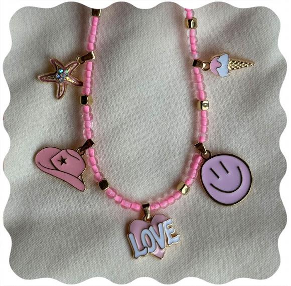 beaded barbie themed necklace